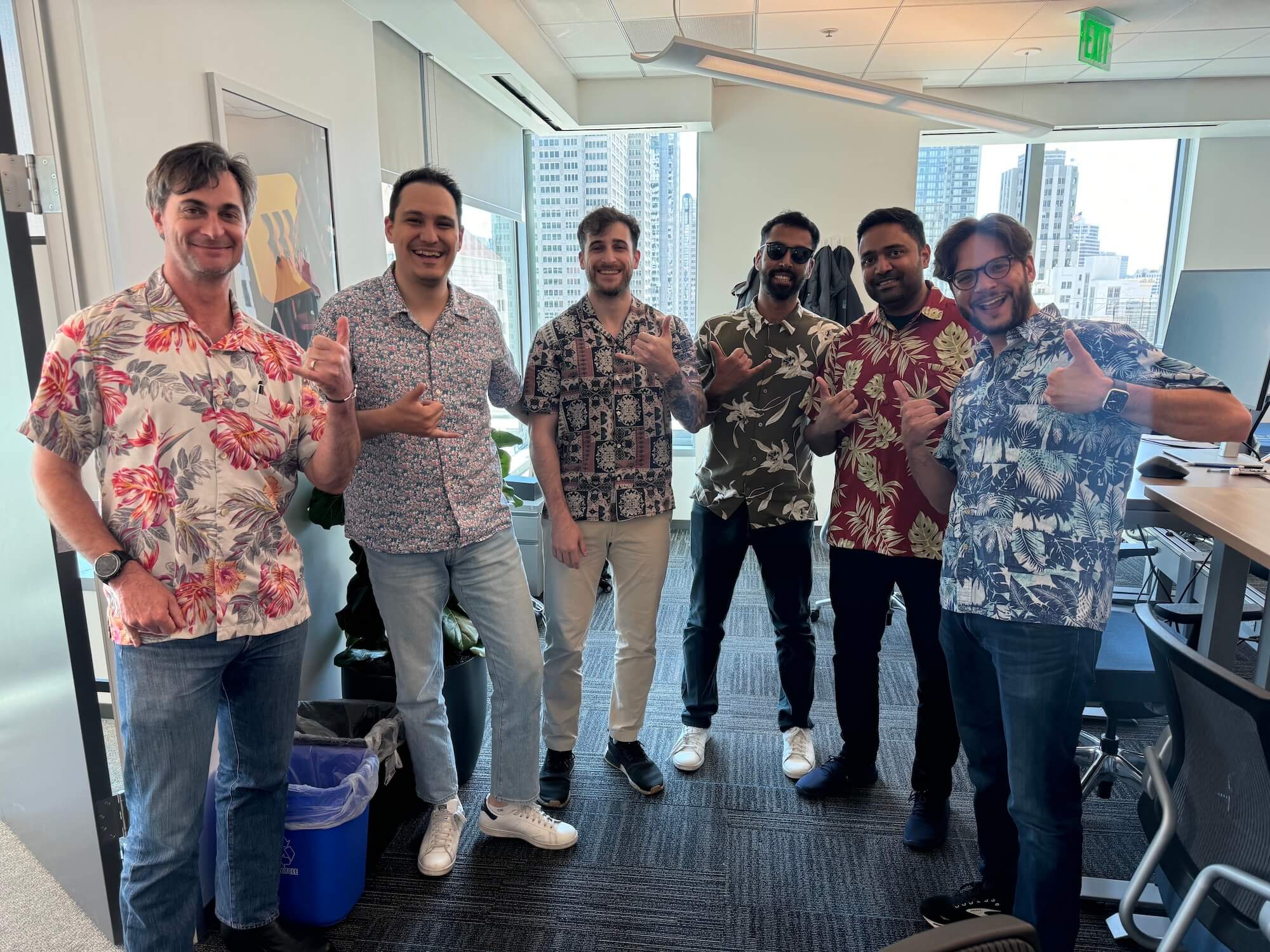 Rippler Michael Bitzos and team, all wearing Hawaiian shirts.
